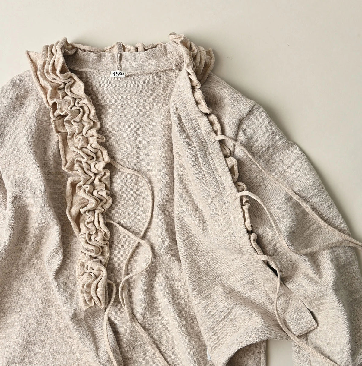 45R Dekoboko Knit-sewn Frilled Bolero